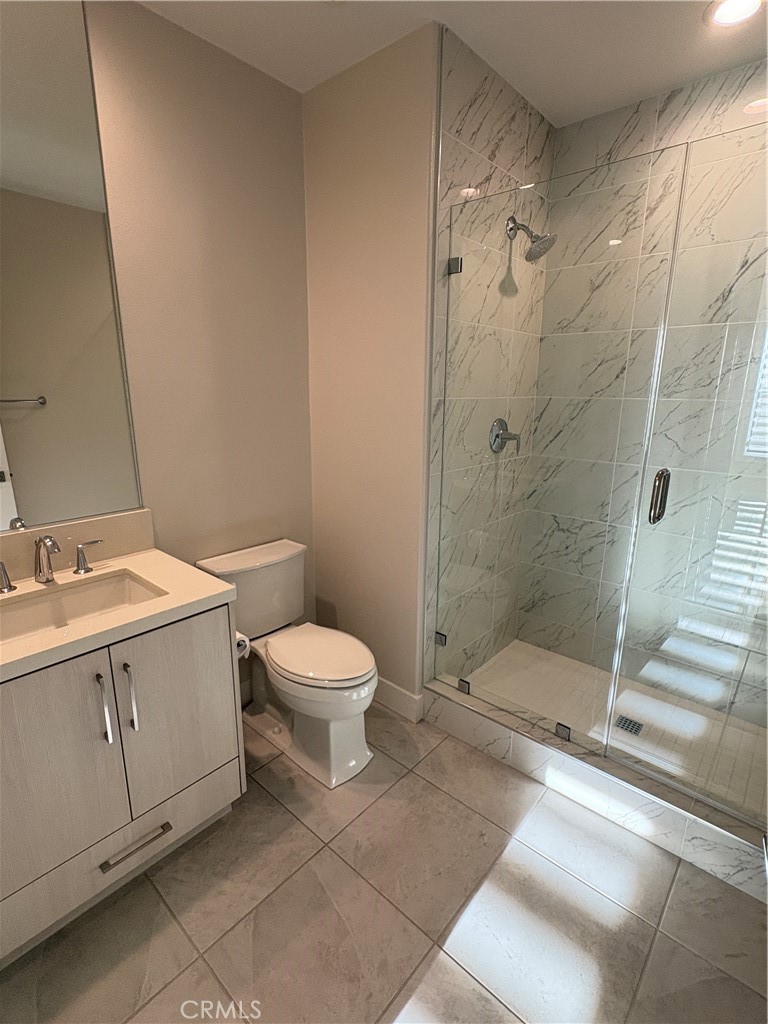 160 Longden Lake Forest, CA 92630 - Photo 8 of 31 a bathroom with a sink a toilet and shower
