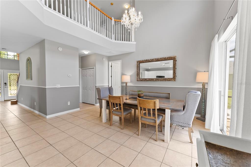 3149 Twisted Oak Loop Kissimmee, FL 34744 - Photo 16 of 52 a dining room with furniture and window