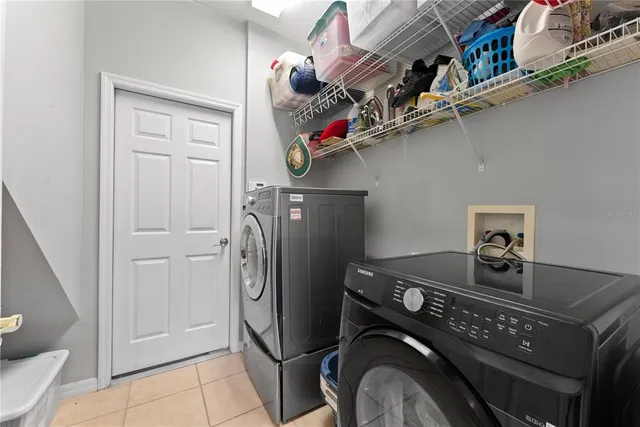a view of a hallway with wooden floor and entryway