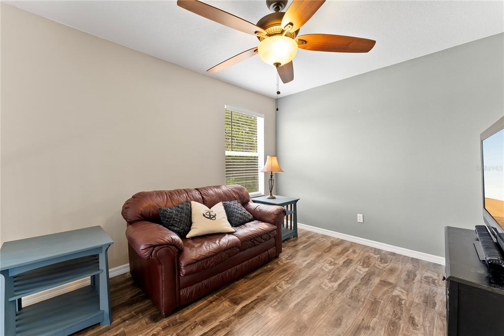 3149 Twisted Oak Loop Kissimmee, FL 34744 - Photo 28 of 52 a living room with furniture and a window