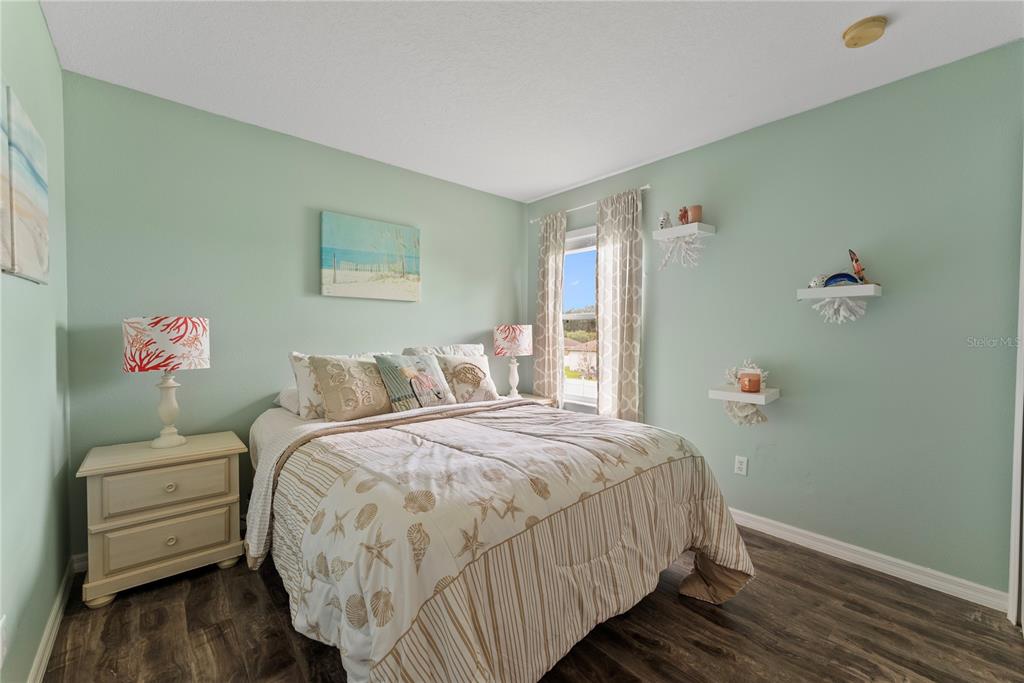 3149 Twisted Oak Loop Kissimmee, FL 34744 - Photo 32 of 52 a bedroom with bed and a window