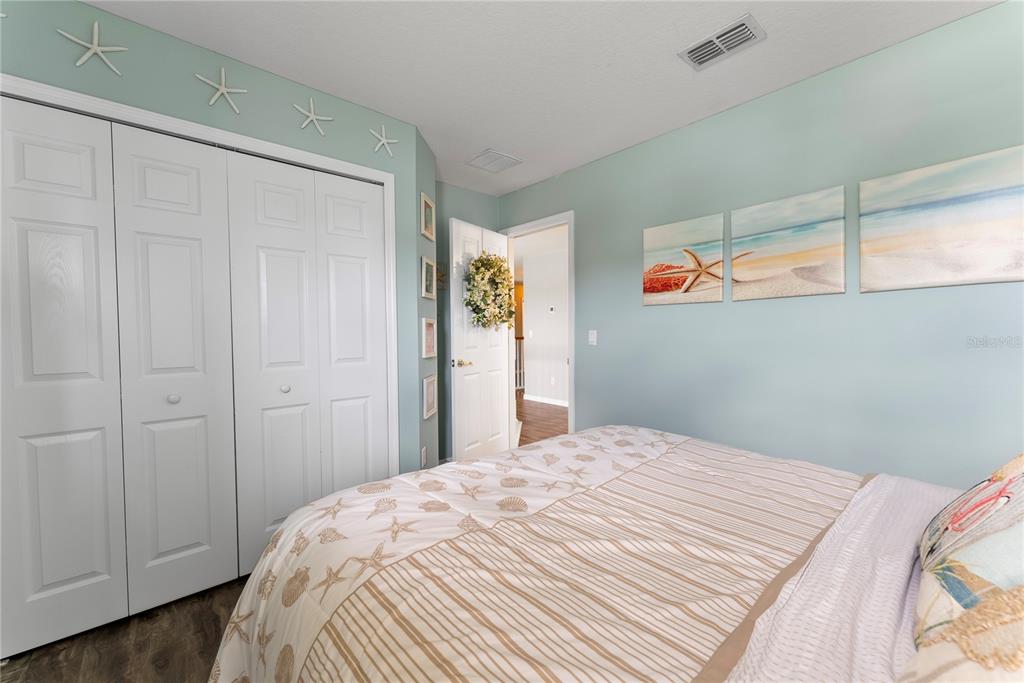 3149 Twisted Oak Loop Kissimmee, FL 34744 - Photo 33 of 52 a bedroom with a bed and a window