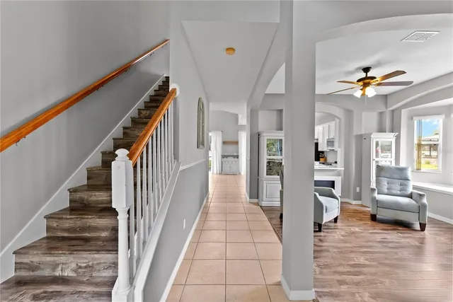 a view of an entryway with wooden floor and a livingroom view