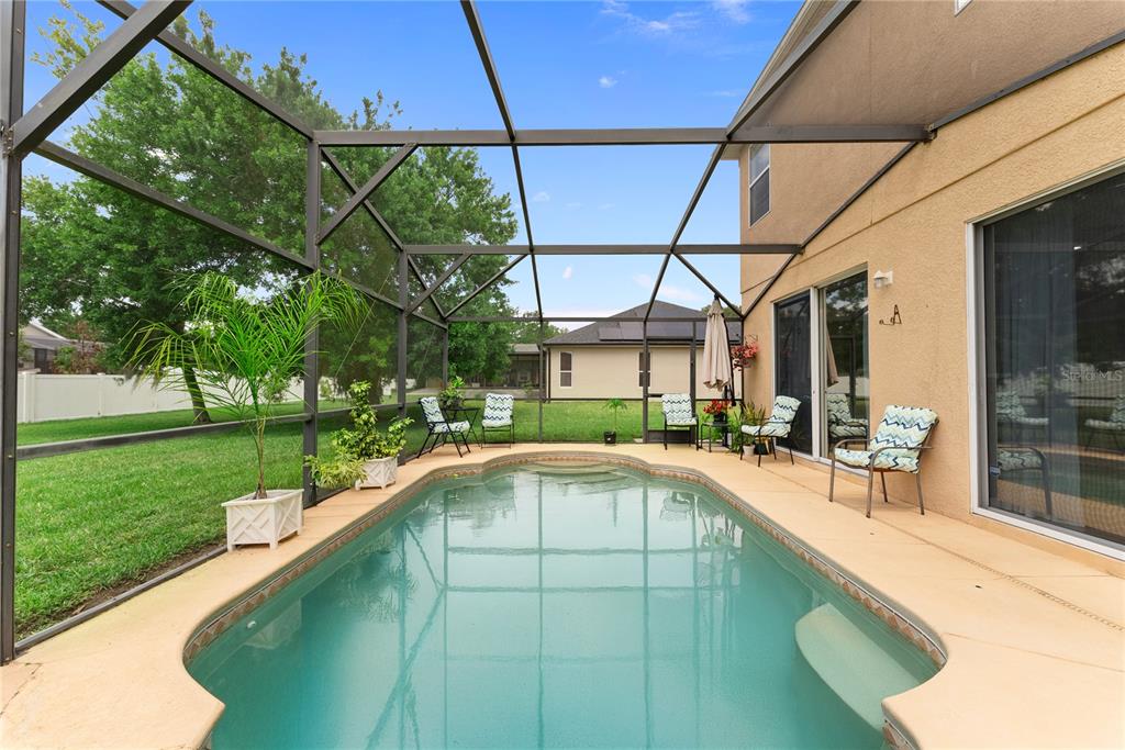 3149 Twisted Oak Loop Kissimmee, FL 34744 - Photo 43 of 52 a view of a house with a swimming pool
