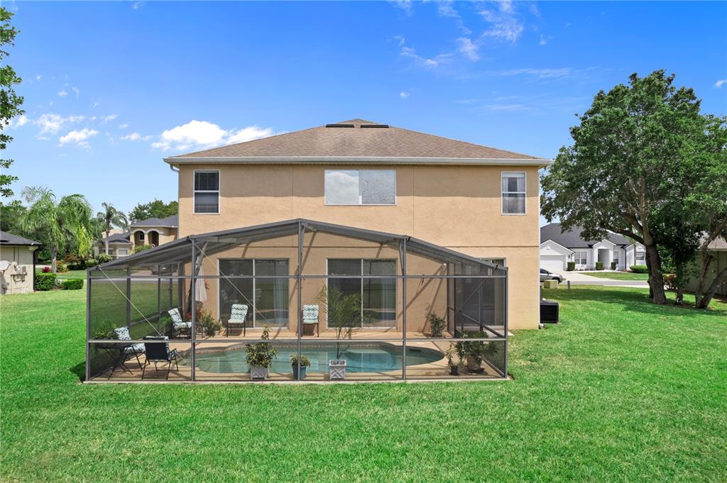 3149 Twisted Oak Loop Kissimmee, FL 34744 - Photo 46 of 52 a view of a house with a yard and sitting area