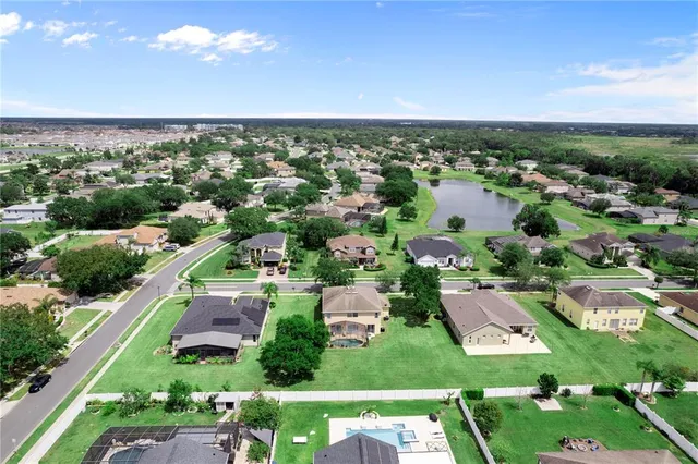 an aerial view of a house with a garden