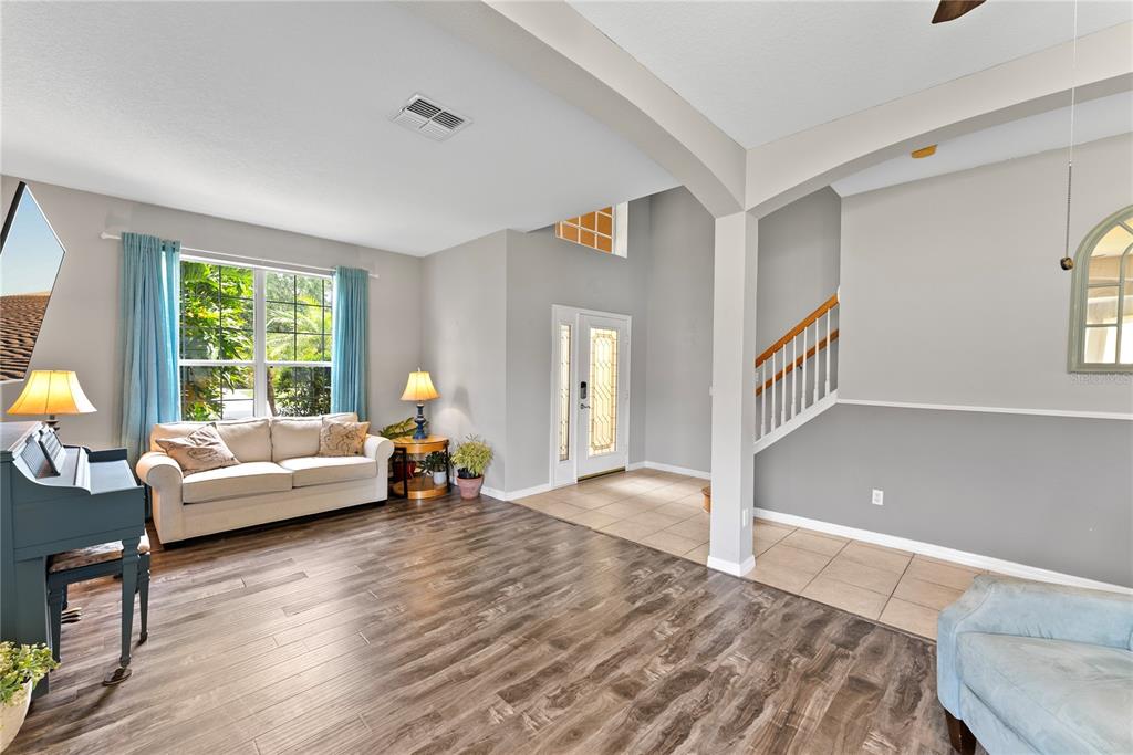 3149 Twisted Oak Loop Kissimmee, FL 34744 - Photo 6 of 52 a living room with furniture and a large window