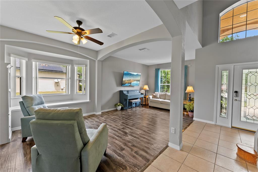 3149 Twisted Oak Loop Kissimmee, FL 34744 - Photo 8 of 52 a living room with furniture and a chandelier