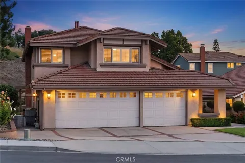 a front view of a house with yard