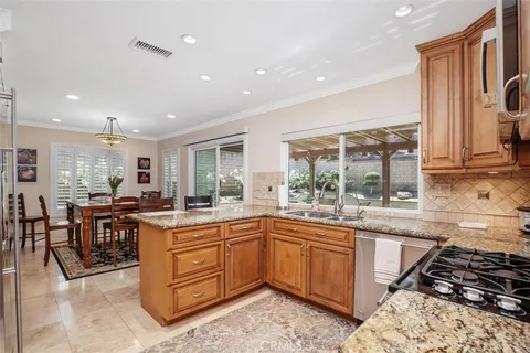 a kitchen with lots of counter top space and stainless steel appliances