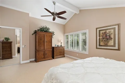 a bedroom with a bed dresser and a window