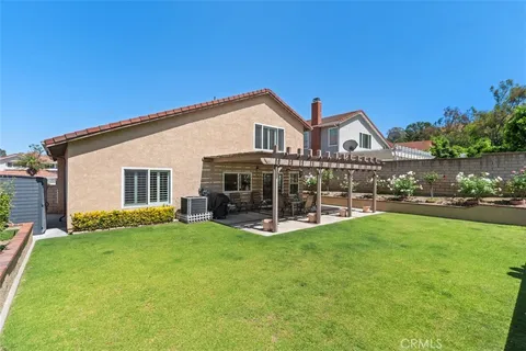 a view of a house with a yard porch and sitting area