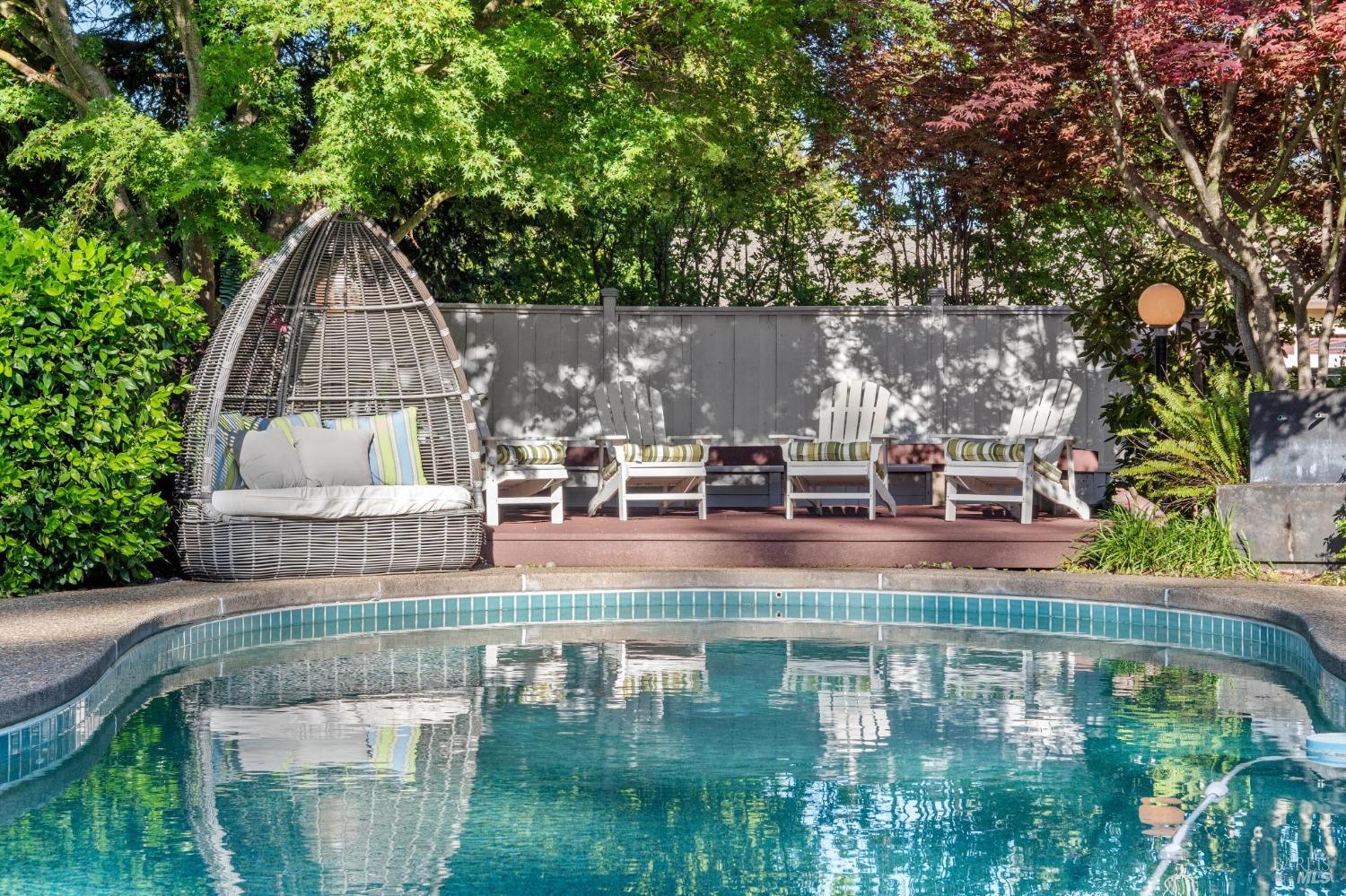 a small pool with outdoor seating