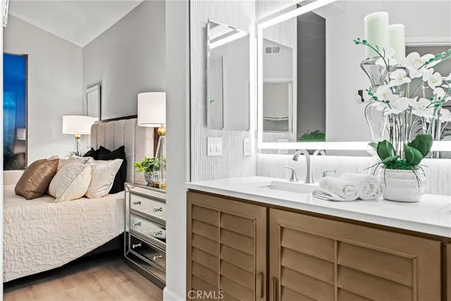 a bedroom with a bed and a potted plant