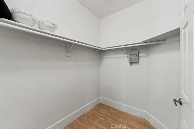 a view of a room with shelf on the wall