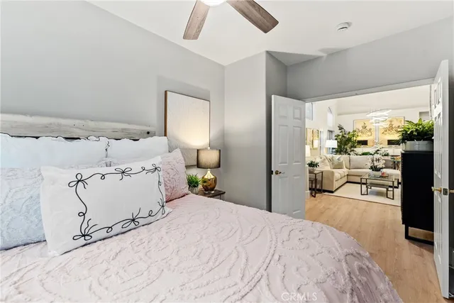 a bed room with a bed and a large mirror