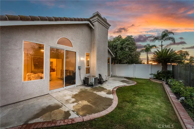 a swimming pool with outdoor seating and yard