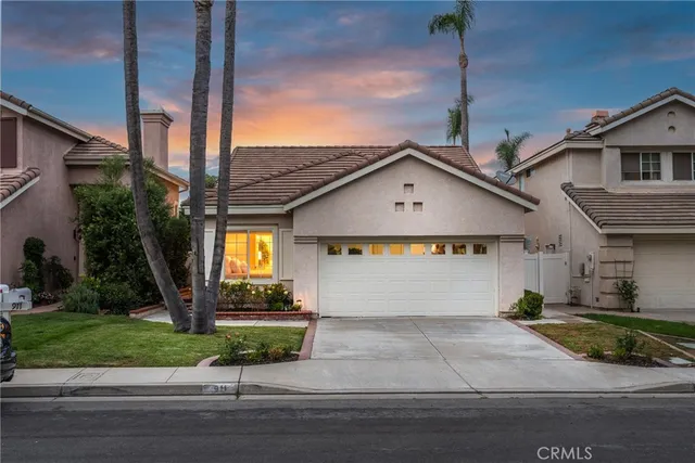 a front view of a house with garage