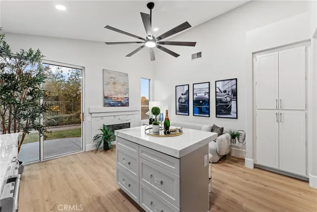 a room with a chandelier furniture and a window