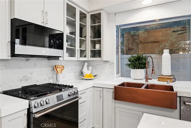 a kitchen with a stove and a microwave