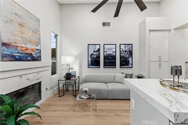 a living room with furniture and a fireplace