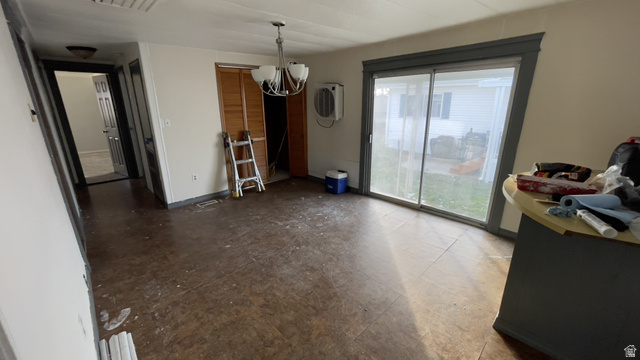 2491 Highway 89, Unit 114 Pleasant View, UT 84404 - Photo 4 of 18 Dining space featuring a chandelier and baseboards