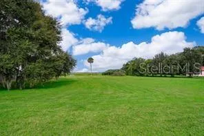 a view of a golf course with a garden