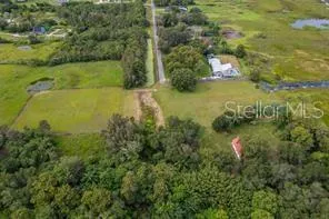 a view of a lake with a yard