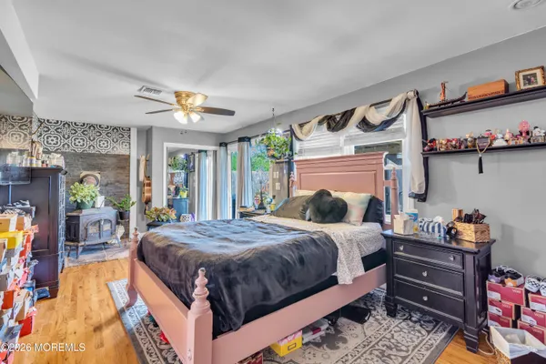 a bed sitting in a bedroom next to a window