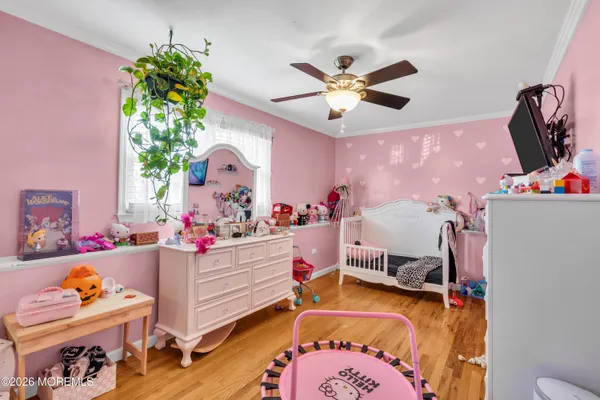 a bedroom with furniture and a chandelier