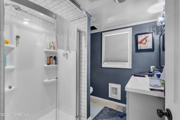a bathroom with a sink mirror and vanity