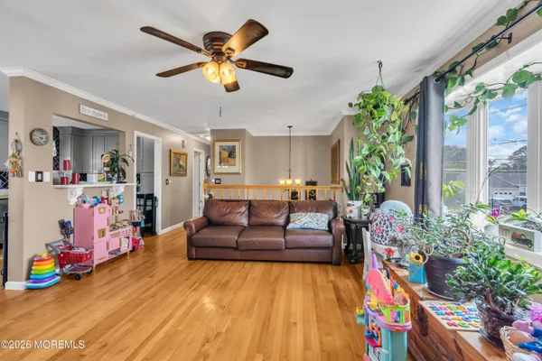 a living room with furniture and flowers