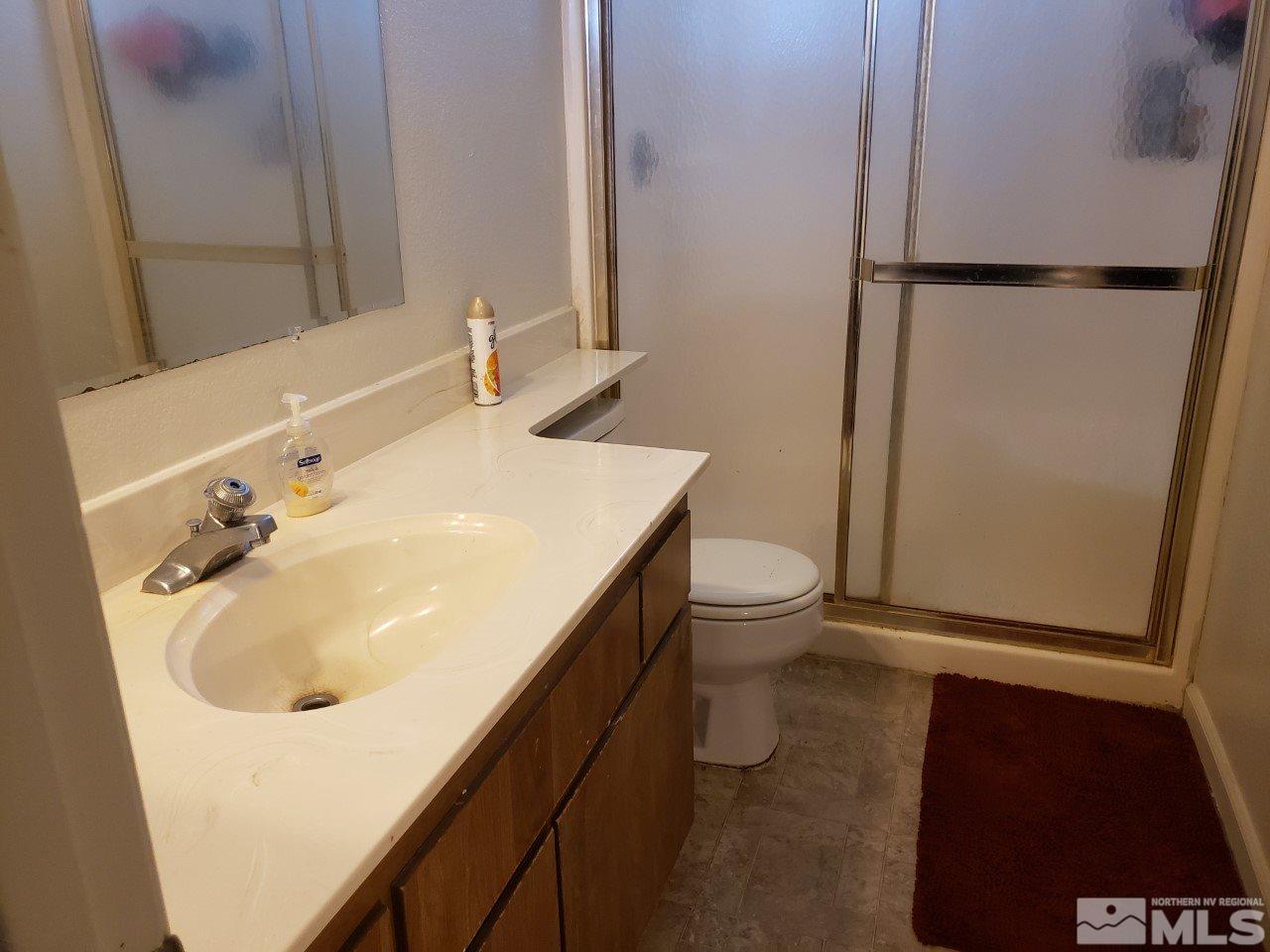 10044 Humite Lane Reno, NV 89506 - Photo 18 of 24 a bathroom with a sink and a toilet