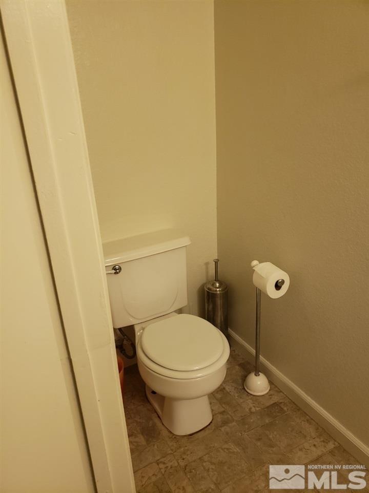 10044 Humite Lane Reno, NV 89506 - Photo 21 of 24 a white toilet sitting next to a sink