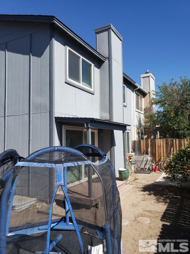 10044 Humite Lane Reno, NV 89506 - Photo 4 of 24 a front view of a house with parking space