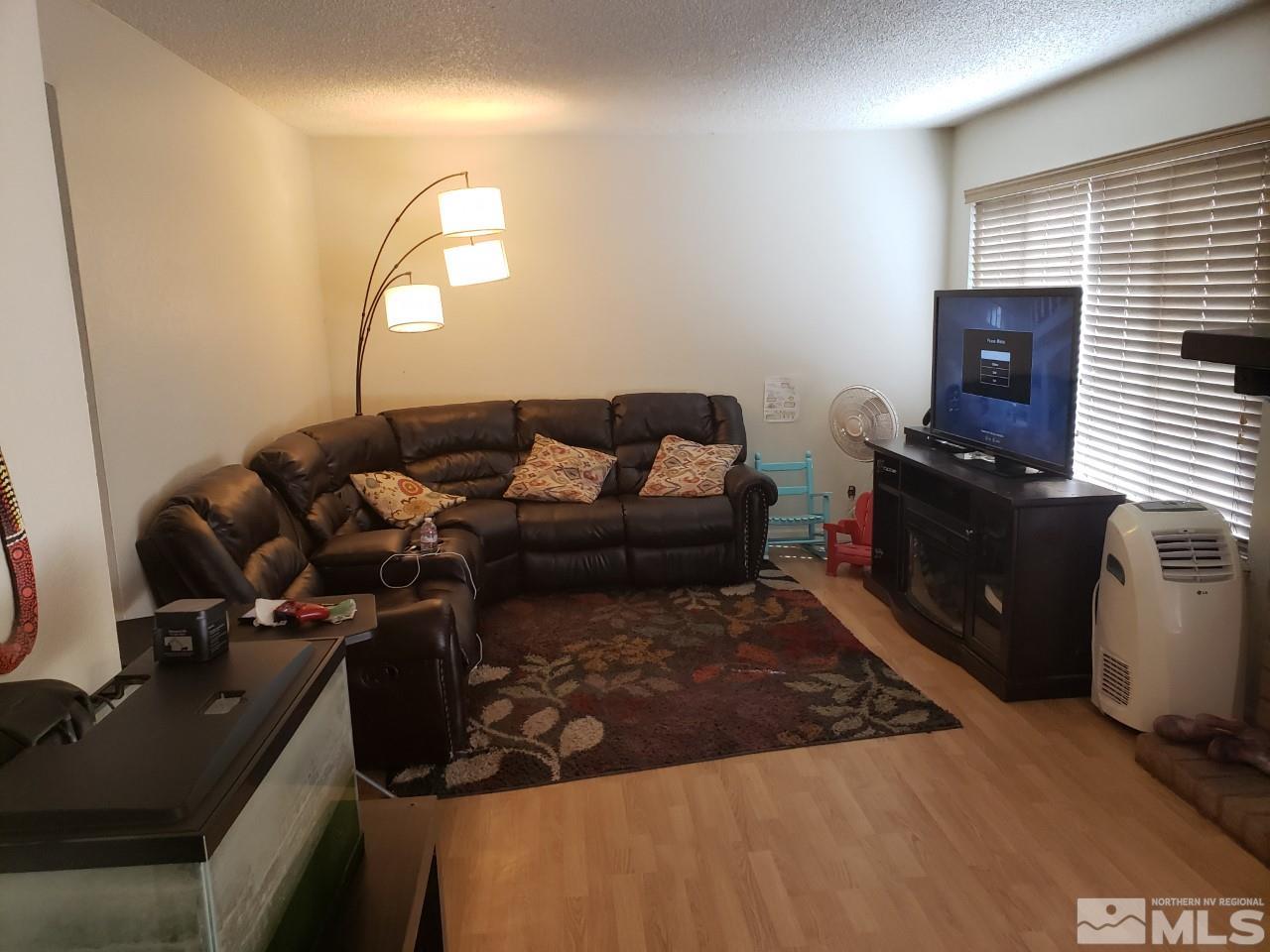 10044 Humite Lane Reno, NV 89506 - Photo 6 of 24 a living room with furniture