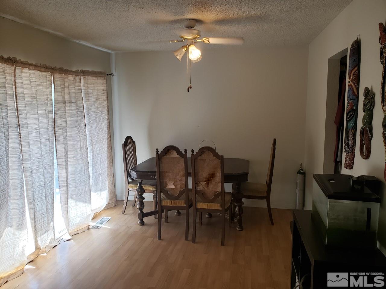 10044 Humite Lane Reno, NV 89506 - Photo 7 of 24 a dining room with furniture and window