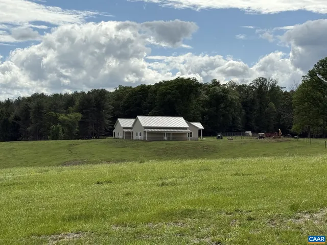 a aerial view of a house with big yard