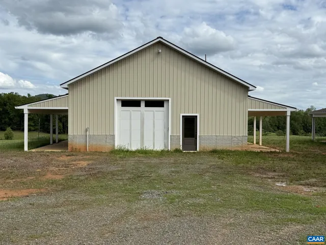 a big house with a big yard and large trees