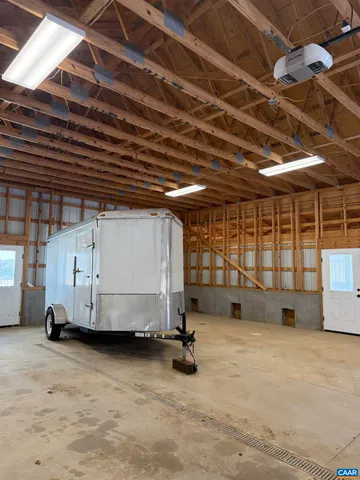 an empty room with closet and a bathroom