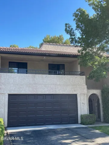 a view of house with outdoor space