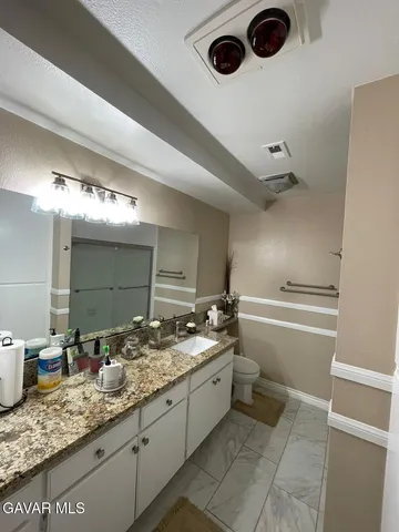 a bathroom with a tub and a sink