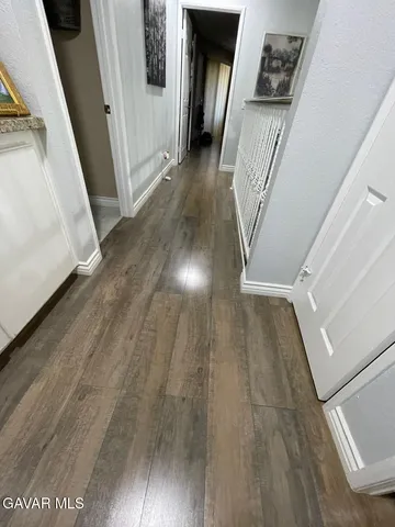 a view of a living room and kitchen