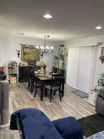a kitchen with a sink a stove and cabinets