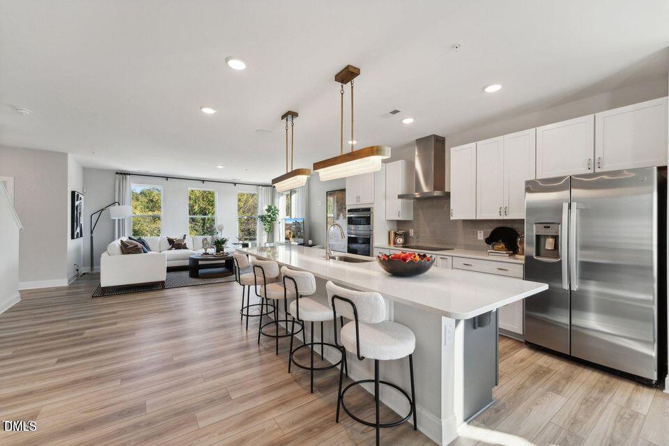 110 Byrum Street, Unit 302 Cary, NC 27511 - Photo 4 of 30 a kitchen with sink cabinets and stainless steel appliances