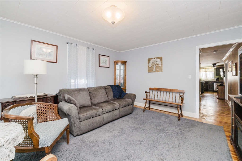 869 Bedford Street Fall River, MA 02723 - Photo 13 of 31 a living room with furniture and a table
