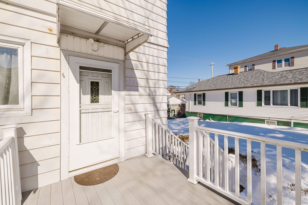 869 Bedford Street Fall River, MA 02723 - Photo 2 of 31 a view of a house with wooden fence