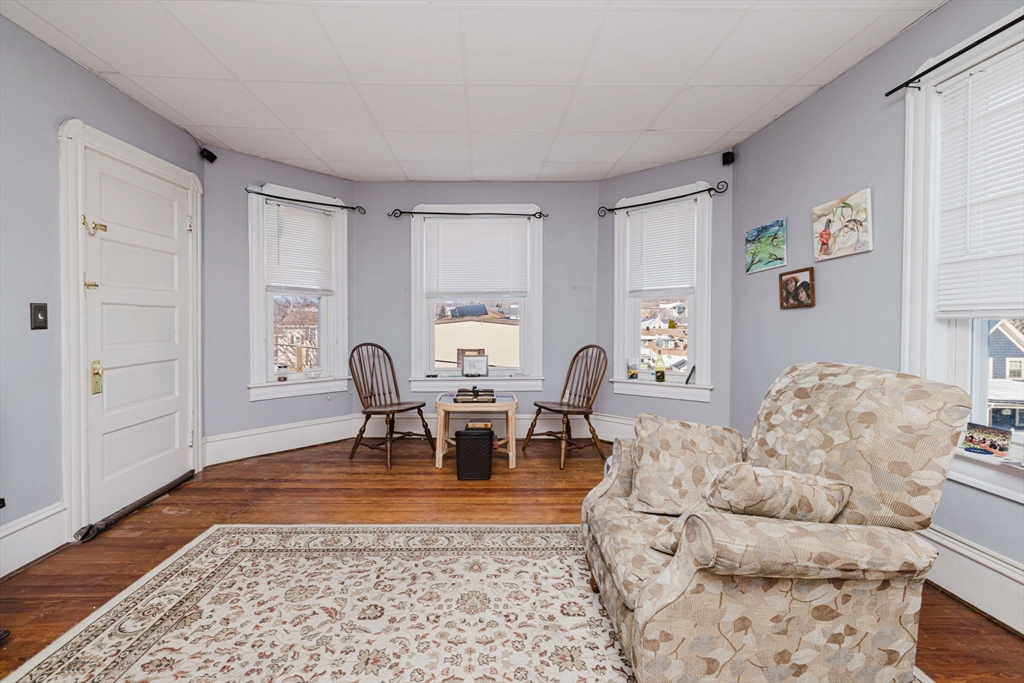 869 Bedford Street Fall River, MA 02723 - Photo 29 of 31 a living room with furniture and wooden floor