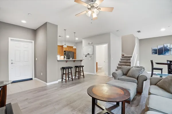 a kitchen with stainless steel appliances granite countertop a stove top oven a refrigerator a sink and a stove