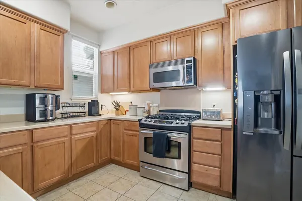 a view of a dining room with furniture and a window